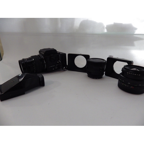 5021 - A Zenza Bronica medium format camera together with three lenses, 82mm, 50mm and 150mm, and accessori... 