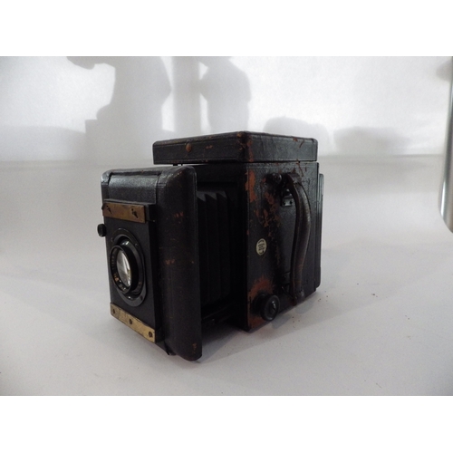 5024 - A Thornton Pickard Special Ruby Reflex Folding Plate Camera with a quantity of plate holders.