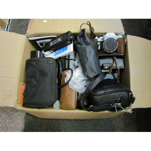 5119 - A box of camera gear and lenes including a Nikon coolpix E5000.