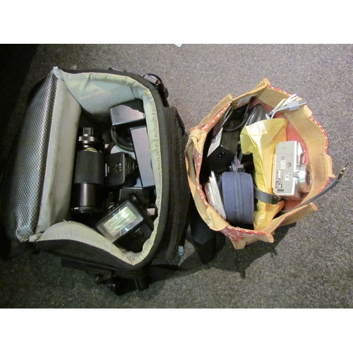 5120 - Two bags of camera gear including a Olympus Mju 300 digital camera.   (E) £15-25