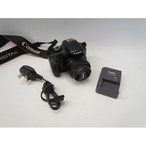 5124 - A Canon EOS 1100D digital SLR camera with 50mm lens and battery charger