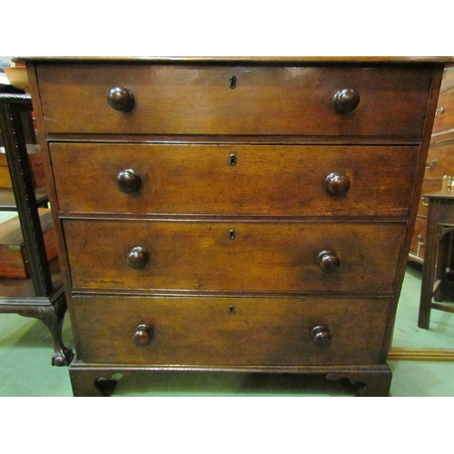 4110 - A 19th Century canted corner oak chest of four graduated long drawers with turned bun handles over b... 