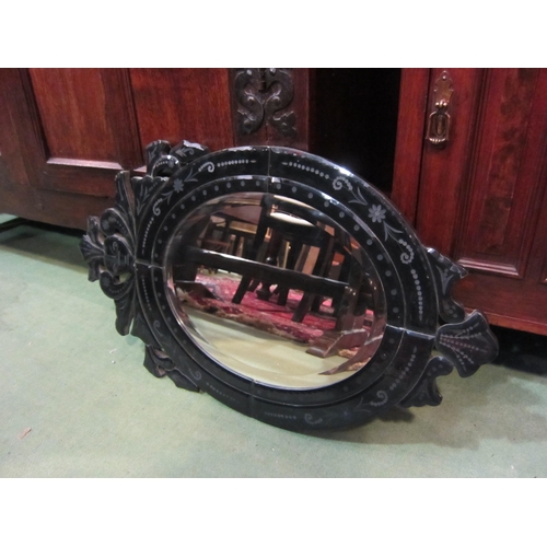 4148 - An oak bevel edged wall mirror and one other (2)