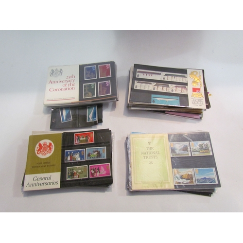 4476 - Approximately 170 first day covers together with approximately 110 mint stamp packs