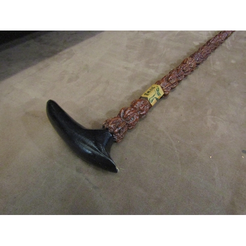 4011 - A Japanese walking cane, walnuts to shaft, ebony handle, character marks to collar