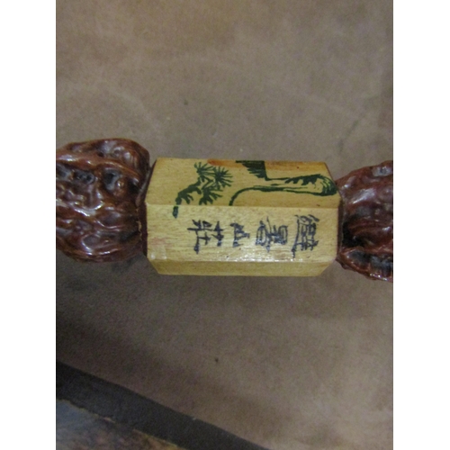 4011 - A Japanese walking cane, walnuts to shaft, ebony handle, character marks to collar