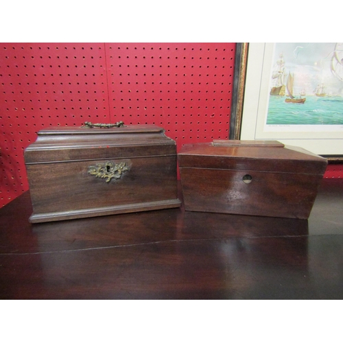 4033 - Two mahogany casket tea caddies, one with brass mounts