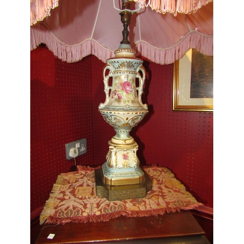 4039 - A pair of oversized china table lamps, floral patterns, enriched with gilt, silk tasselled shades