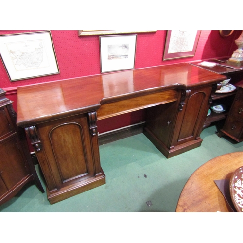 4048 - A circa 1860 flame mahogany twin pedestal sideboard with central drawer and carved corbel decoration... 