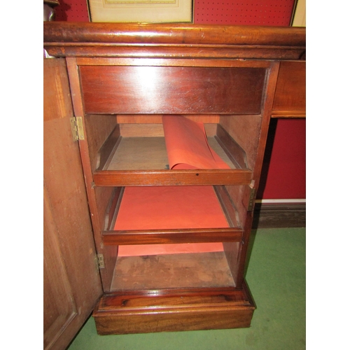 4048 - A circa 1860 flame mahogany twin pedestal sideboard with central drawer and carved corbel decoration... 