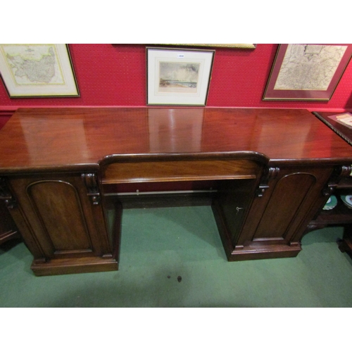 4048 - A circa 1860 flame mahogany twin pedestal sideboard with central drawer and carved corbel decoration... 