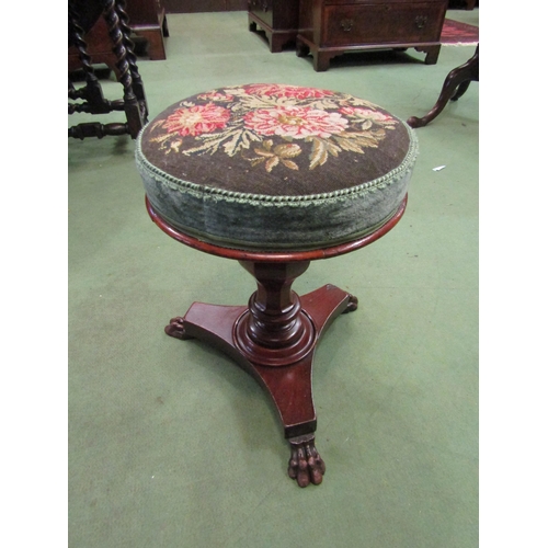 4049 - A circa 1840 mahogany circular seat stool with needlepoint upholstery over a chamfered bulbous colum... 