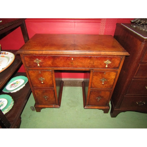 4056 - An early George III revival walnut twin pedestal desk of small proportions with five drawers over br... 