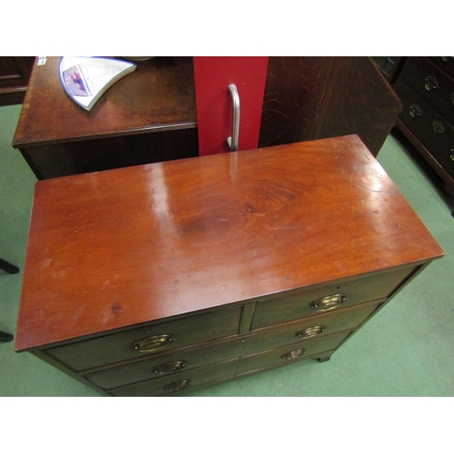 4070 - A 19th Century and later flame mahogany chest of two short over two long drawers with brass oval pla... 