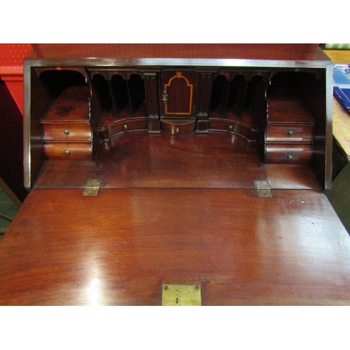 4096 - An early George III Cuban mahogany bureau, the fully fitted interior over two short and three gradua... 