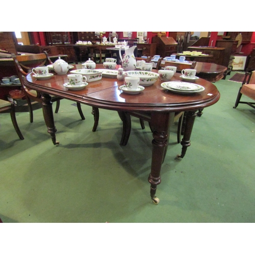 4105 - A 19th Century mahogany extending dining table with extra leaf on turned legs and castors, 75cm tall... 