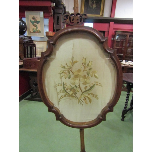 4112 - A mahogany pole fire screen with silk floral embroidery (a/f) on tripod scrolled feet   (E) £15-25