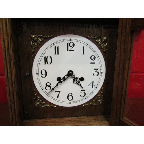 4120 - An oak cased 7-day bracket clock with key and pendulum