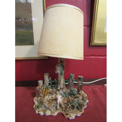 4140 - A Sheringham Pottery table lamp base as a figure and animals beside pond, a/f   (E) £10-15 or Group