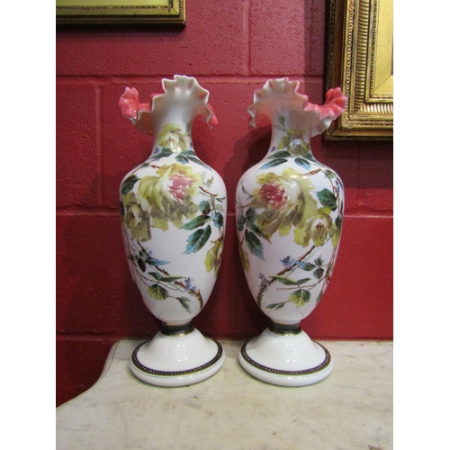 4145 - A pair of early 20th Century handpainted glass vases, frilled rim, enriched with gilt, 42cm tall