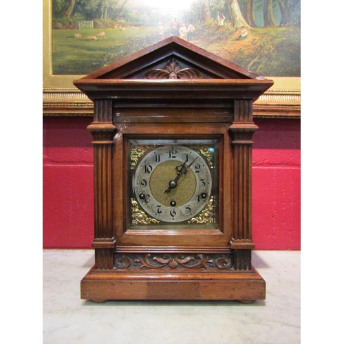 4146 - An early 20th Century walnut mantel clock of architectural form, carved detail and reeded columns, A... 