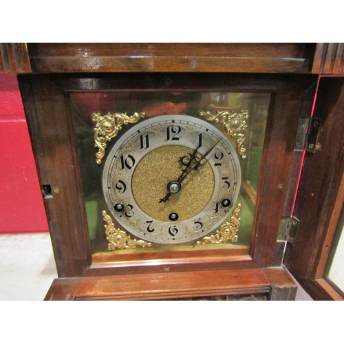 4146 - An early 20th Century walnut mantel clock of architectural form, carved detail and reeded columns, A... 