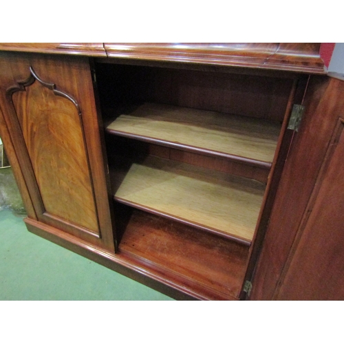 4155 - A circa 1840 flame mahogany chiffonier, the raised serpentine upstand over two frieze drawers and tw... 