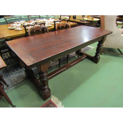 4167 - A 17th Century revival oak refectory dining table with cleated ends over turned legs joined by an H ... 