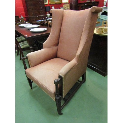 4169 - A circa 1840 mahogany wing back armchair with carved and turned arm supports over square tapering fo... 