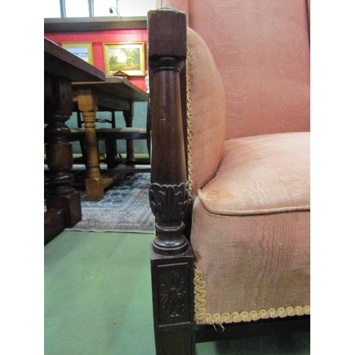 4169 - A circa 1840 mahogany wing back armchair with carved and turned arm supports over square tapering fo... 