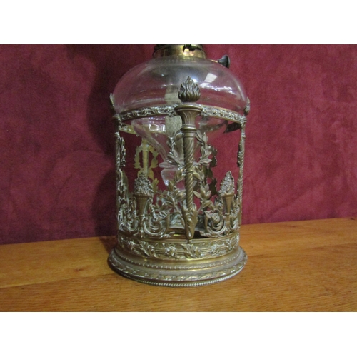 4185 - A late Victorian oil lamp, cranberry tin shade, pierced foliate design base