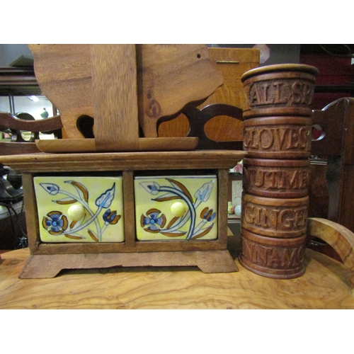 4190 - Indian hardwood and ceramic spice drawers, a treen spice tower, a set of pig platters and an olive w... 