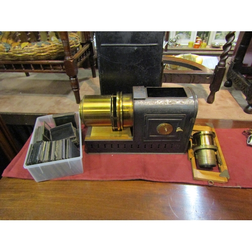 4201 - A Victorian magic lantern projector with an assortment of glass slides including Mahdist War era