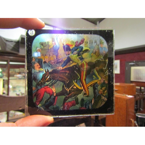 4201 - A Victorian magic lantern projector with an assortment of glass slides including Mahdist War era