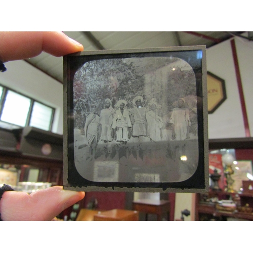 4201 - A Victorian magic lantern projector with an assortment of glass slides including Mahdist War era