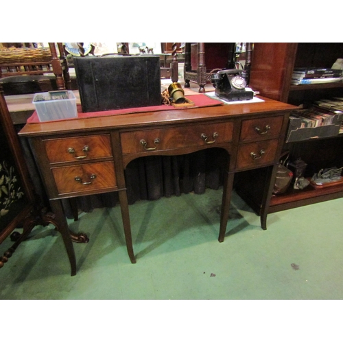 4202 - A Georgian flame mahogany sideboard with five drawers and central kneehole aperture over outswept sq... 