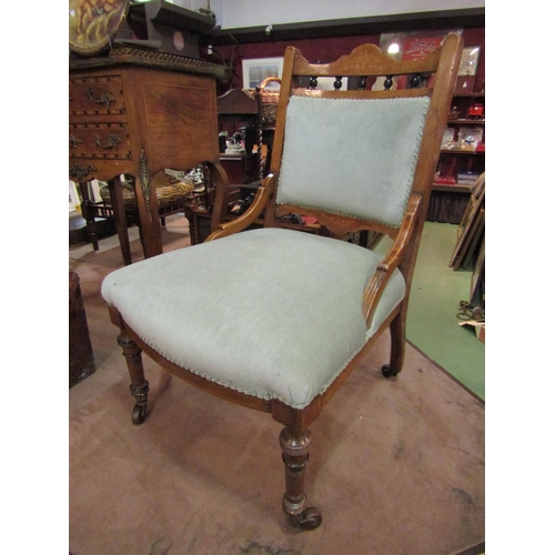 4206 - An Edwardian inlaid walnut bedroom chair with green upholstery and turned spindle decoration on ring... 