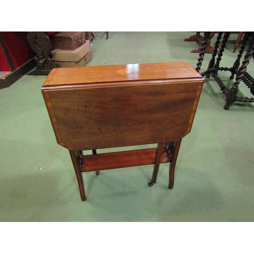 4210 - An Edwardian crossbanded mahogany canted corner Sutherland table with central fan paterae inlay, the... 