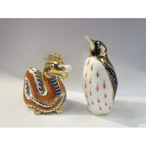 4333 - Two Crown Derby paperweights - Penguin, clear stopper, and a Dragon with silver stopper,  no boxes, ... 