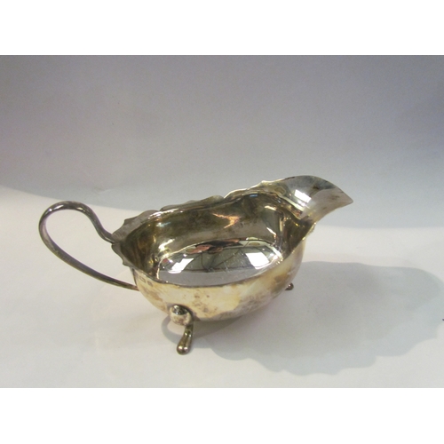 4341 - An Adie Brothers Ltd silver sauce boat, wavy rim, on three feet, Birmingham 1934, 108g