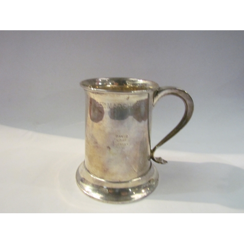 4369 - A Thomas Bradbury & Sons Ltd silver tankard, 10cm tall, plain form with stepped base, Sheffield 1925... 