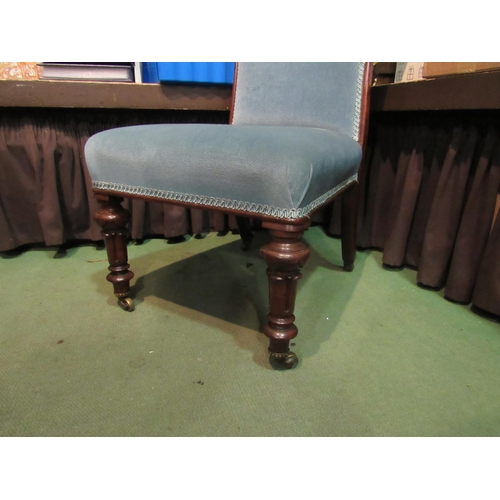 4002 - A blue upholstered chair on castors    (R) £30