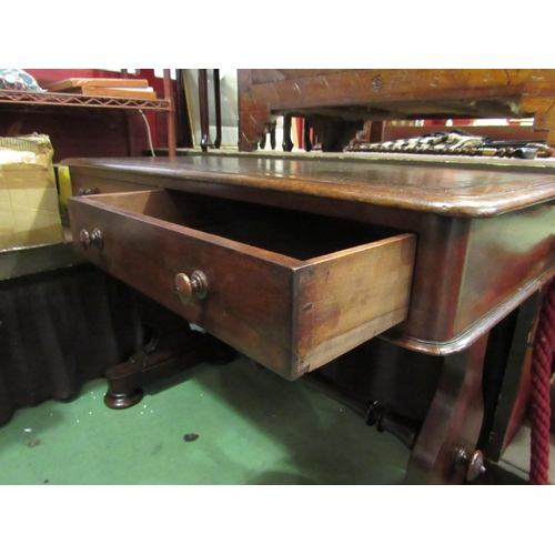 4005 - An early Victorian mahogany writing table the tooled leather writing surface over two frieze drawers... 