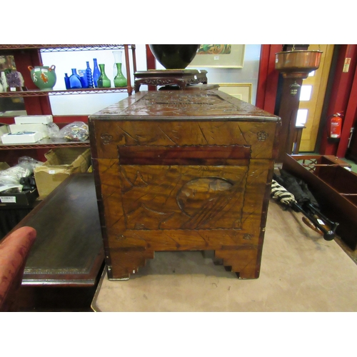 4009 - An Oriental heavily carved camphor wood chest, 97cm wide x 50cm deep x 57cm tall