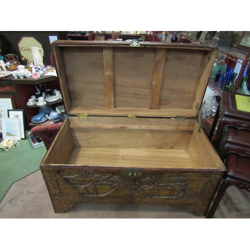 4009 - An Oriental heavily carved camphor wood chest, 97cm wide x 50cm deep x 57cm tall