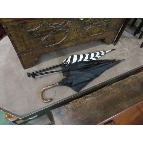 4010 - Two Victorian umbrellas and another, damage present (3)    (E) £15-25