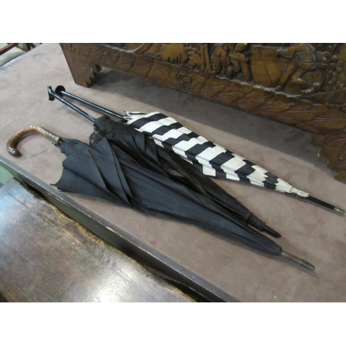 4010 - Two Victorian umbrellas and another, damage present (3)    (E) £15-25