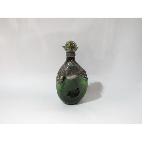 4244 - An early-mid 20th Century Danish green dimpled glass bottle with pewter overlay, later millefiori gl... 