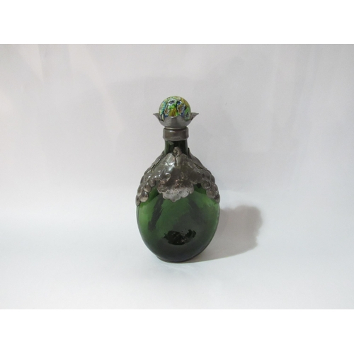 4244 - An early-mid 20th Century Danish green dimpled glass bottle with pewter overlay, later millefiori gl... 