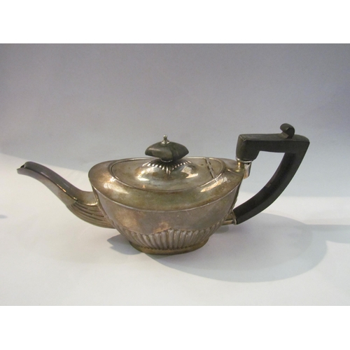 4366 - A late Victorian silver bachelor's teapot, fluted body, ebonised handle, marks rubbed, Birmingham 18... 